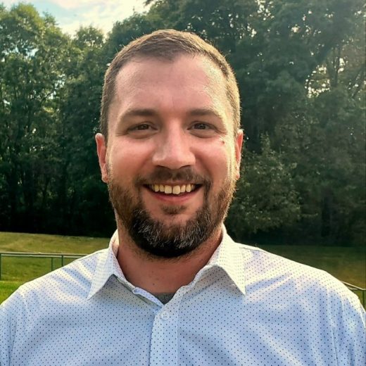 Headshot of Travis Barkel